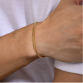 Le L'Eclat Gold bracelet on wrist