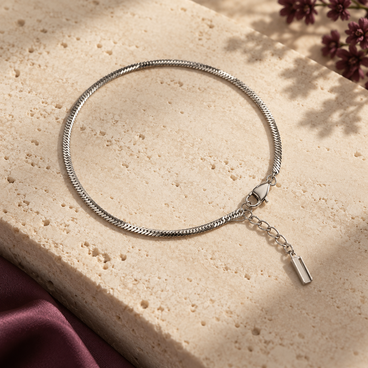 Silver L’Éclat bracelet on travertine